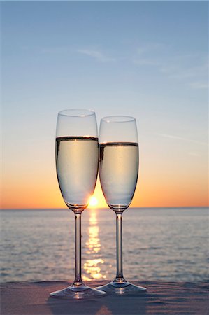 romantic beach sunset - Two glasses of champagne at sunset Stock Photo - Premium Royalty-Free, Code: 649-03771352