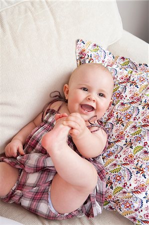 simsearch:6115-07539732,k - Baby laying on couch Stock Photo - Premium Royalty-Free, Code: 649-03772171