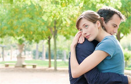 friend comfort hug - Couple embrace in park in Paris Stock Photo - Premium Royalty-Free, Code: 649-03772242