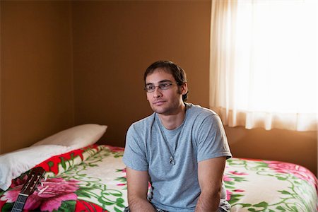 depressed young man - Man sitting on bed Stock Photo - Premium Royalty-Free, Code: 649-03772302