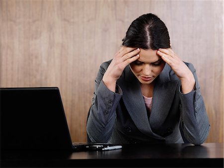 depression work - Business woman head in hands in office Stock Photo - Premium Royalty-Free, Code: 649-03772779