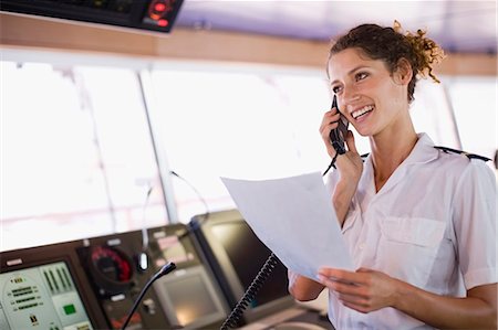 ship - Mate of a ship doing a phone call Stock Photo - Premium Royalty-Free, Code: 649-03796325