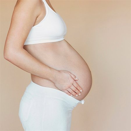 stomach (lower abdomen) - Pregnancy bump, profile Stock Photo - Premium Royalty-Free, Code: 649-03796570