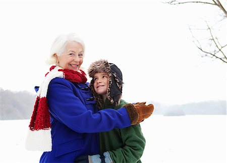 A senior female and a boy in the snow Stock Photo - Premium Royalty-Free, Code: 649-03796819