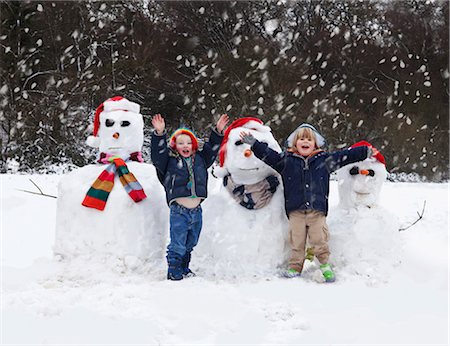 Two boys and their snowmen Stock Photo - Premium Royalty-Free, Code: 649-03796823