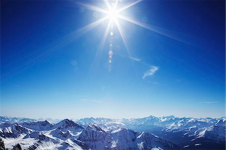 sunray - Sun over snow covered mountains Foto de stock - Sin royalties Premium, Código: 649-03857160