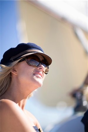simsearch:614-00602699,k - Woman wearing sunglasses on boat Stock Photo - Premium Royalty-Free, Code: 649-03857310