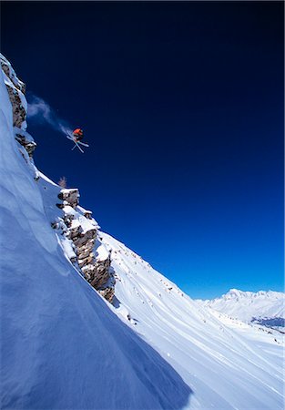extreme skiing cliff - Skier making jump on mountainside Stock Photo - Premium Royalty-Free, Code: 649-03884133