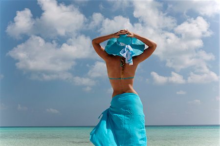 Woman standing on tropical beach Stock Photo - Premium Royalty-Free, Code: 649-03881492