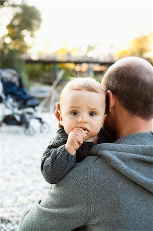 family white space - Father holding baby outdoors Stock Photo - Premium Royalty-Free, Code: 649-03881885