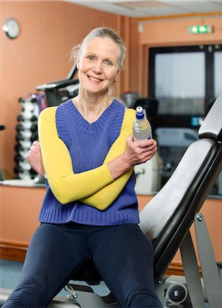 fitness older women gym - Older woman drinking water in gym Stock Photo - Premium Royalty-Free, Code: 649-03881956