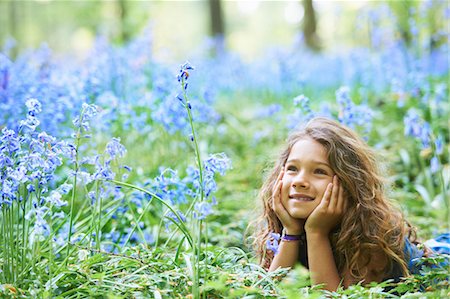 spring field - Girl laying in field of flowers Stock Photo - Premium Royalty-Free, Code: 649-03882241