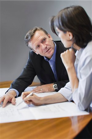 photos of serious business people - Business people working in office Stock Photo - Premium Royalty-Free, Code: 649-03882414