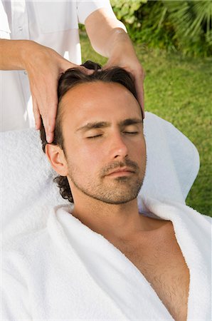 simsearch:649-06164622,k - Man having scalp massage outdoors Stock Photo - Premium Royalty-Free, Code: 649-03883449
