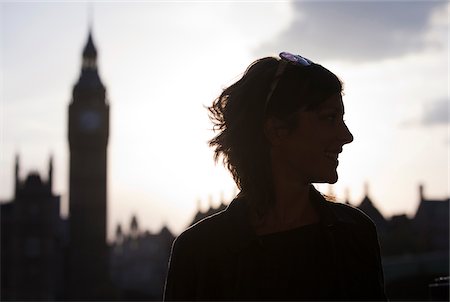 UK, London, Mid adult woman smiling, Big Ben in background Stock Photo - Premium Royalty-Free, Code: 640-05760857