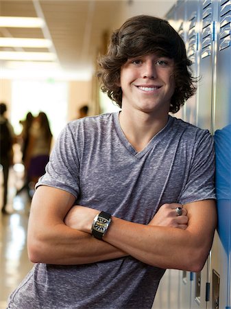 student (male) - USA, Utah, Portrait of young man in school corridor Stock Photo - Premium Royalty-Free, Code: 640-05761048