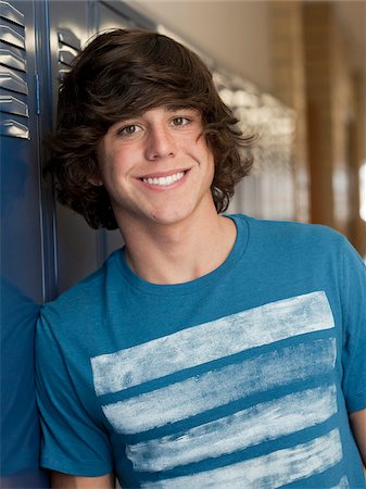 student (male) - USA, Utah, Spanish Fork, Portrait of school boy standing by lockers Stock Photo - Premium Royalty-Free, Code: 640-05761084
