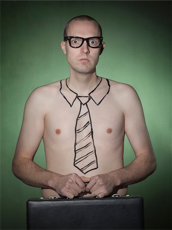 Portrait of young businessman with tie tattoo, holding briefcase Stock Photo - Premium Royalty-Free, Code: 640-05761213