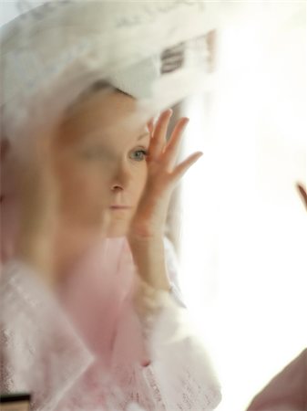 USA, Utah, Cedar Hills, Woman looking into mirror covered with steam Stock Photo - Premium Royalty-Free, Code: 640-05761319