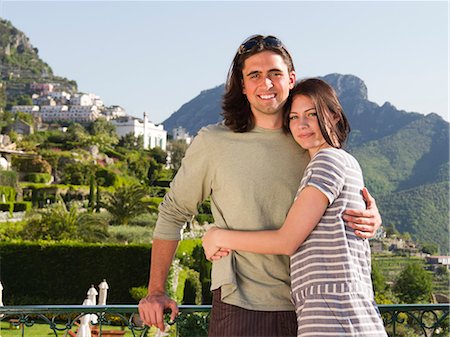 simsearch:640-06050299,k - Italy, Ravello, Portrait of young couple smiling near mountain town Stock Photo - Premium Royalty-Free, Code: 640-06049887