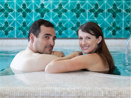 simsearch:640-06049939,k - Italy, Amalfi Coast, Ravello, Mature couple looking over shoulder in swimming pool Stock Photo - Premium Royalty-Free, Code: 640-06050150