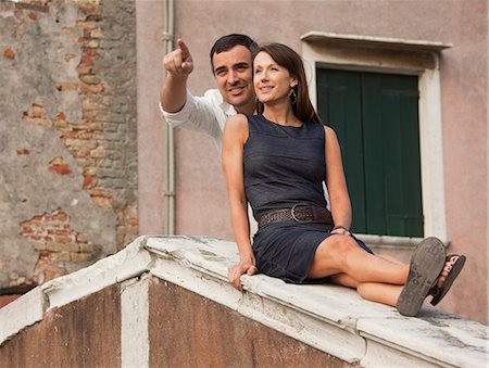 simsearch:640-06049939,k - Italy, Venice, Romantic couple sitting on rooftop Stock Photo - Premium Royalty-Free, Code: 640-06050190