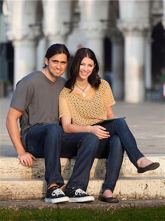 simsearch:640-06050299,k - Italy, Venice, Portrait of young couple sitting on steps on St. Mark's Square Stock Photo - Premium Royalty-Free, Code: 640-06050275