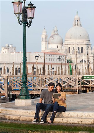 simsearch:640-06050299,k - Italy, Venice, Young couple using digital tablet, Santa Maria Della Salute church in background Stock Photo - Premium Royalty-Free, Code: 640-06050278