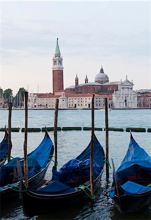 Italy, Venice, San Giorgio Maggiore church seen across lagoon, gondolas in foreground Stock Photo - Premium Royalty-Free, Code: 640-06050287