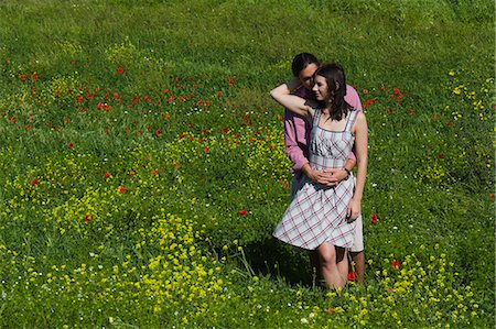 simsearch:640-06050299,k - Italy, Tuscany, Young couple embracing on meadow Stock Photo - Premium Royalty-Free, Code: 640-06050297