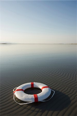 life preserver in the middle of nowhere Stock Photo - Premium Royalty-Free, Code: 640-06051623