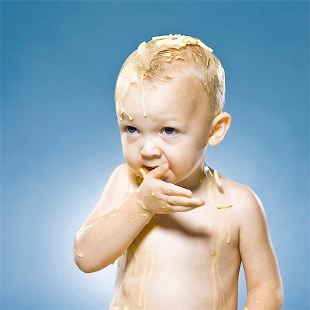 slime - baby covered in macaroni and chees Stock Photo - Premium Royalty-Free, Code: 640-06051671