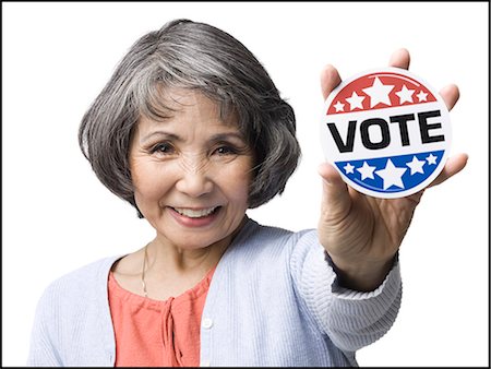 sticker - woman with a "vote" button Stock Photo - Premium Royalty-Free, Code: 640-06051783