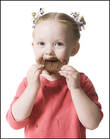child eating chocolate Stock Photo - Premium Royalty-Free, Code: 640-06051891