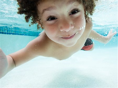 USA, Utah, Orem, Boy (4-5) swimming in swimming pool Stock Photo - Premium Royalty-Free, Code: 640-06963362