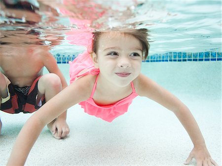 USA, Utah, Orem, Boy (4-5) and girl (4-5) swimming in pool Stock Photo - Premium Royalty-Free, Code: 640-06963379