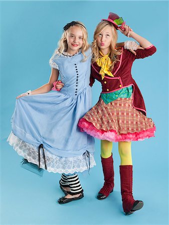 simsearch:614-03469543,k - Two girls (10-11) in Alice in Wonderland costumes for Halloween Stock Photo - Premium Royalty-Free, Code: 640-06963547