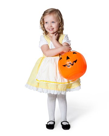 dress up girl - Girl (2-3) in Goldilocks costume with pumpkin lantern for Halloween Stock Photo - Premium Royalty-Free, Code: 640-06963601