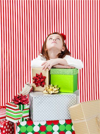 simsearch:640-03260410,k - Studio shot of girl (4-5) with stack of Christmas gifts Stock Photo - Premium Royalty-Free, Code: 640-06963710
