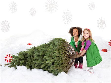 snow christmas tree white - Two girls (18-23 months,4-5) pulling christmas tree Stock Photo - Premium Royalty-Free, Code: 640-06963740