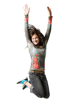 simsearch:640-03259938,k - Studio portrait of teenage girl (16-17) jumping, smiling Stock Photo - Premium Royalty-Free, Code: 640-08088995