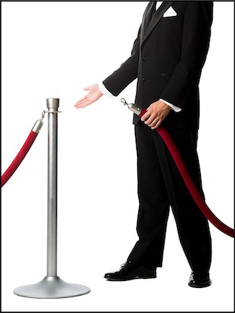 man in a tuxedo next to a velvet rope Stock Photo - Premium Royalty-Free, Code: 640-08089125