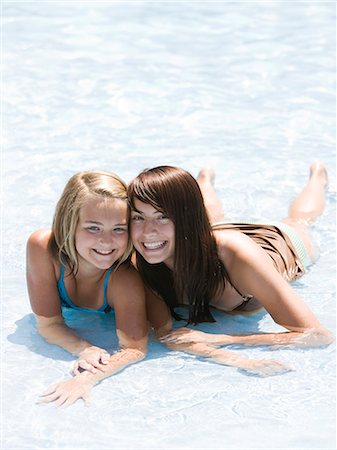 two sisters at a water park Stock Photo - Premium Royalty-Free, Code: 640-08089163