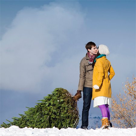 snow christmas tree white - young couple together in the snow Stock Photo - Premium Royalty-Free, Code: 640-08089262