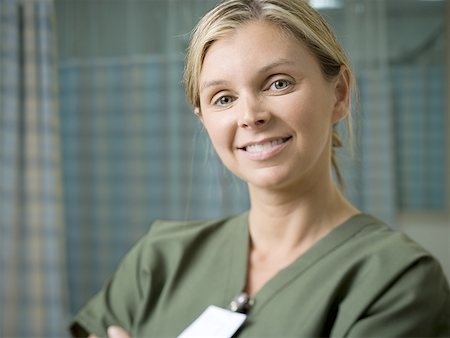 simsearch:640-01364042,k - Portrait of a female nurse smiling Stock Photo - Premium Royalty-Free, Code: 640-01348340