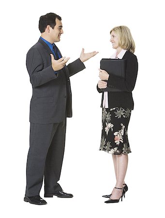 Businessman and a businesswoman talking Stock Photo - Premium Royalty-Free, Code: 640-01348367