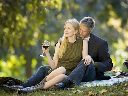 sexual woman on top of man - Couple having a picnic in a park Stock Photo - Premium Royalty-Free, Code: 640-01348376