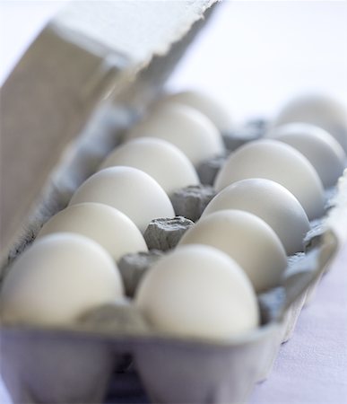 dozen - Close-up of eggs in an egg carton Stock Photo - Premium Royalty-Free, Code: 640-01348412