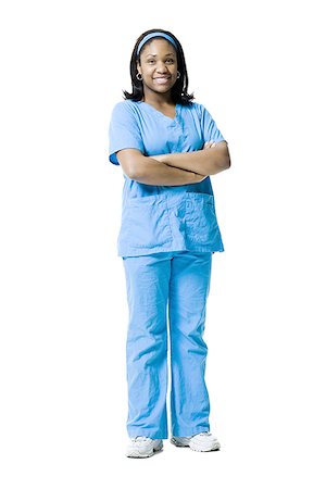Portrait of a female nurse standing with her Arms Crossed Stock Photo - Premium Royalty-Free, Code: 640-01348457