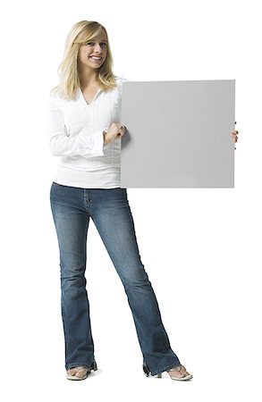 simsearch:640-01349238,k - Portrait of a young woman holding a blank sign Stock Photo - Premium Royalty-Free, Code: 640-01348883